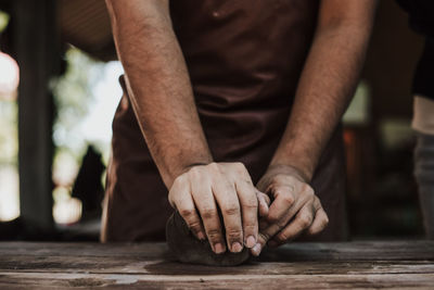 Close-up of man working on table