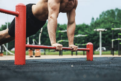 Man doing push-ups in playground