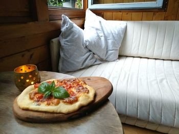 Close-up of pizza on bed at home