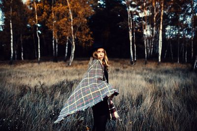 Person standing on grassy field