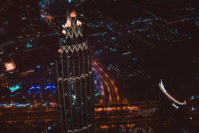 High angle view of illuminated buildings in city at night