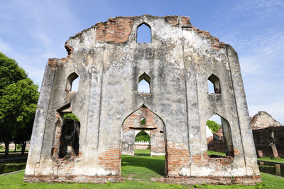 Low angle view of old ruin church against sky