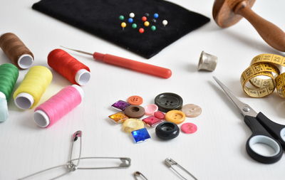 Close-up of sewing items on table