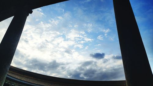 Low angle view of sky seen through glass window