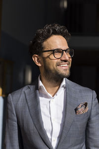 Smiling male real estate agent wearing eyeglasses