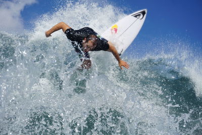 Man splashing water in sea