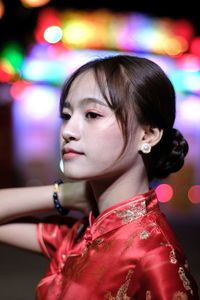 Portrait of beautiful asian woman wearing red dress in chinese new year festival.