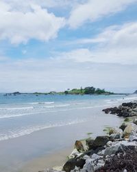 Scenic view of sea against cloudy sky