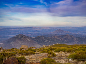 Scenic view of landscape against cloudy sky