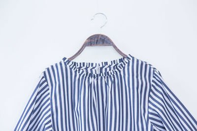 High angle view of striped cloth against white background