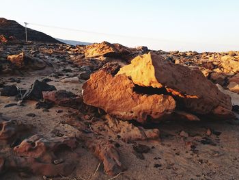 Rock formation on land against sky