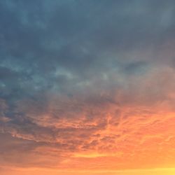 Low angle view of dramatic sky during sunset