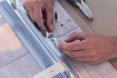 Furniture assembling - carpentry joins up the table