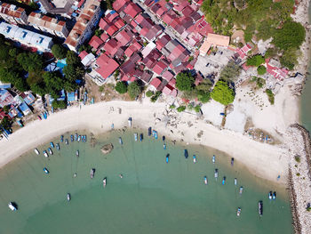 High angle view of people by building in city