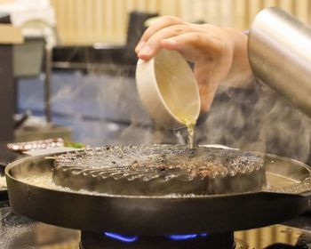 Close-up of person preparing food