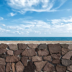 Scenic view of sea shore against sky
