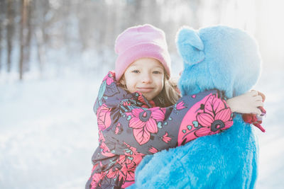 Portrait of smiling girl in snow