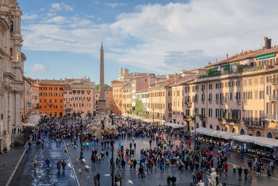 Group of people in front of buildings in city