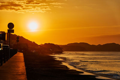 Scenic view of beach against sky during sunset