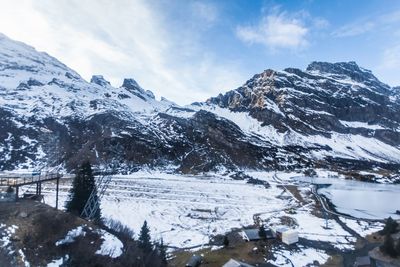 Scenic view of mountains against sky during winter