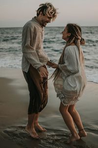 Full length of couple on beach