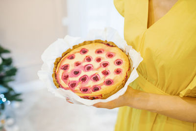 Baked cherry pie in the hands of a girl person
