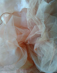 High angle view of people on white fabric
