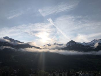 Scenic view of snowcapped mountains against sky