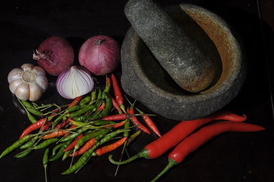 Close-up of red chili peppers in container