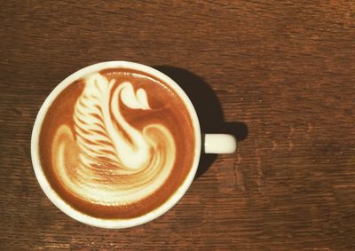 Close-up of cappuccino on table