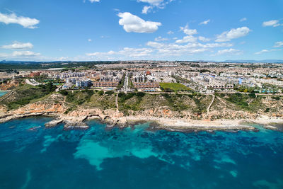 Aerial view of townscape against sky