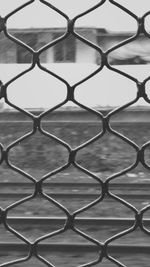 Full frame shot of chainlink fence against sky