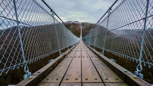 Footbridge against sky