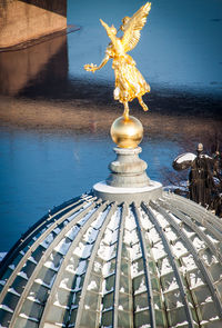 Low angle view of statue against building