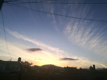 Panoramic view of city against sky during sunset