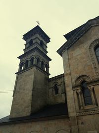 Low angle view of bell tower against sky