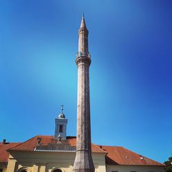 Low angle view of building against blue sky