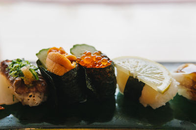 Close-up of sushi served on table