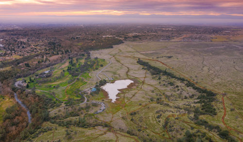 High angle view of river amidst landscape against sky