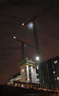 Low angle view of illuminated street light at night