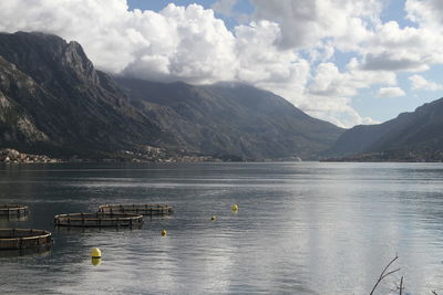 Scenic view of lake and mountains against sky