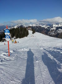 Scenic view of snow covered landscape against sky