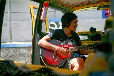 Young man playing guitar