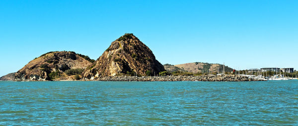 Scenic view of sea against clear blue sky