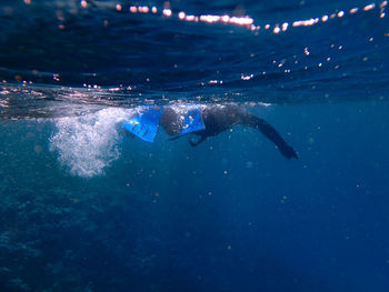 People swimming in sea