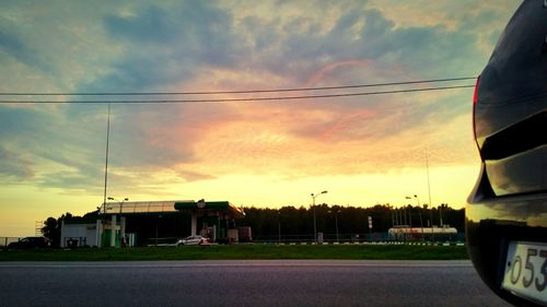 Road against cloudy sky at sunset