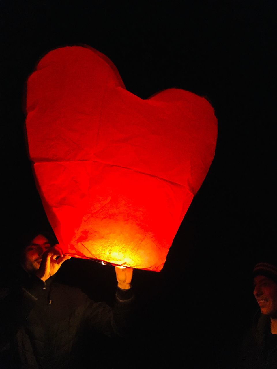 RED LANTERN AGAINST BLACK BACKGROUND