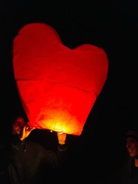 Illuminated lantern against black background