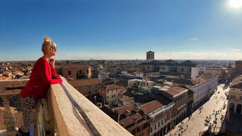 High angle view of woman standing against buildings