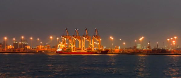 View of illuminated buildings against sky